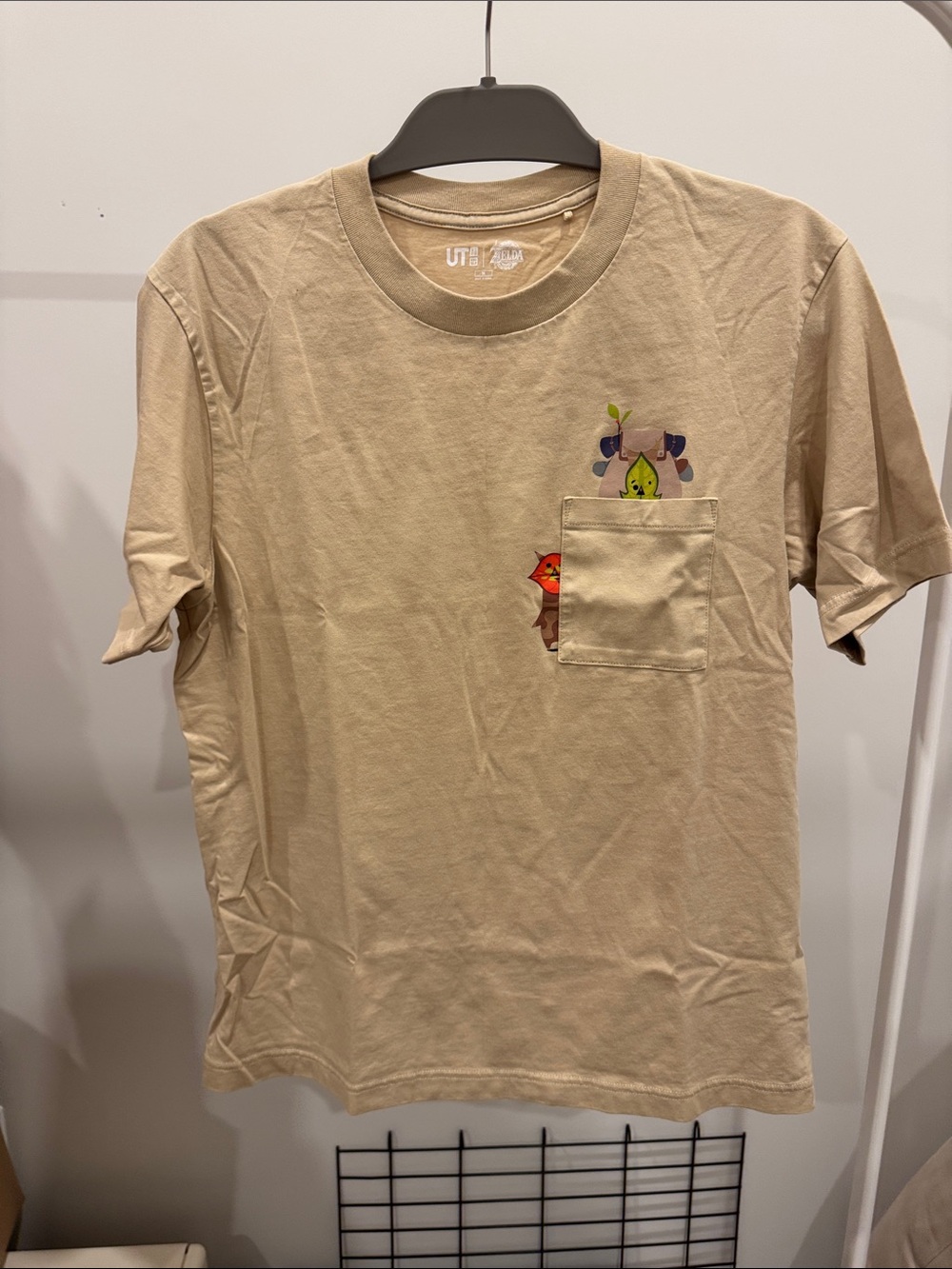 Uniqlo Beige Pocket Tee with Colorful Character Prints
